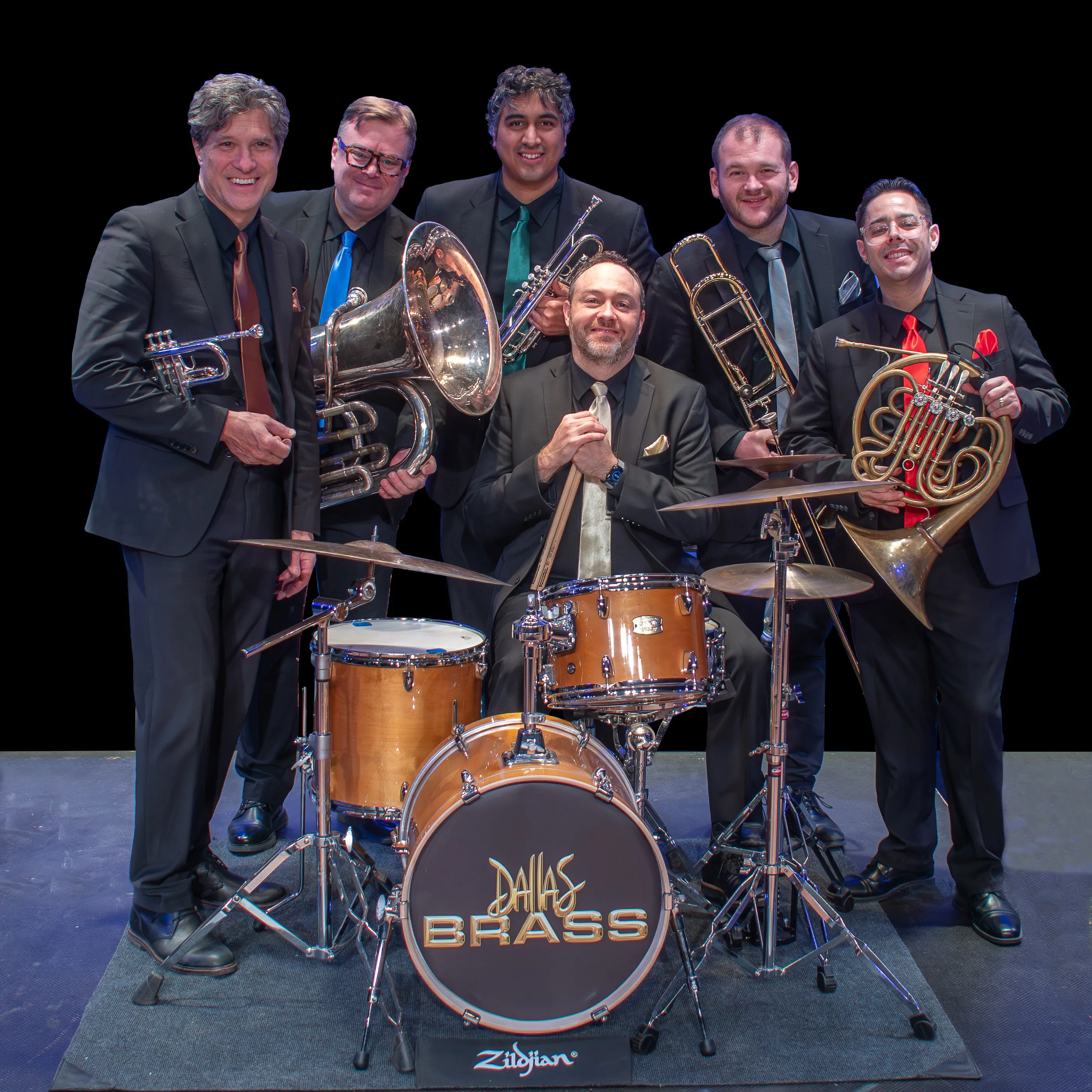 Features brass instruments with a full complement of drums and percussion covering classical masterpieces, Broadway, Hollywood and American music. Includes a special appearance by the Oelwein HS Band!